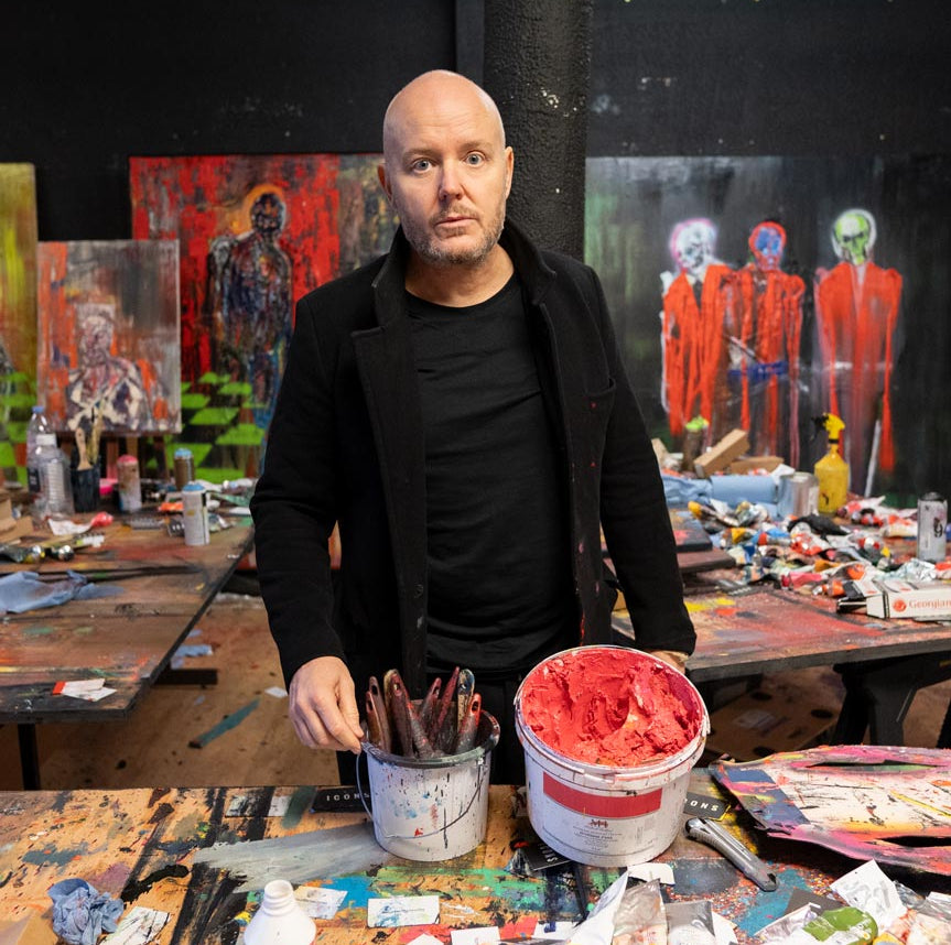 Lincoln Townley artist in his studio with art supplies and paintings